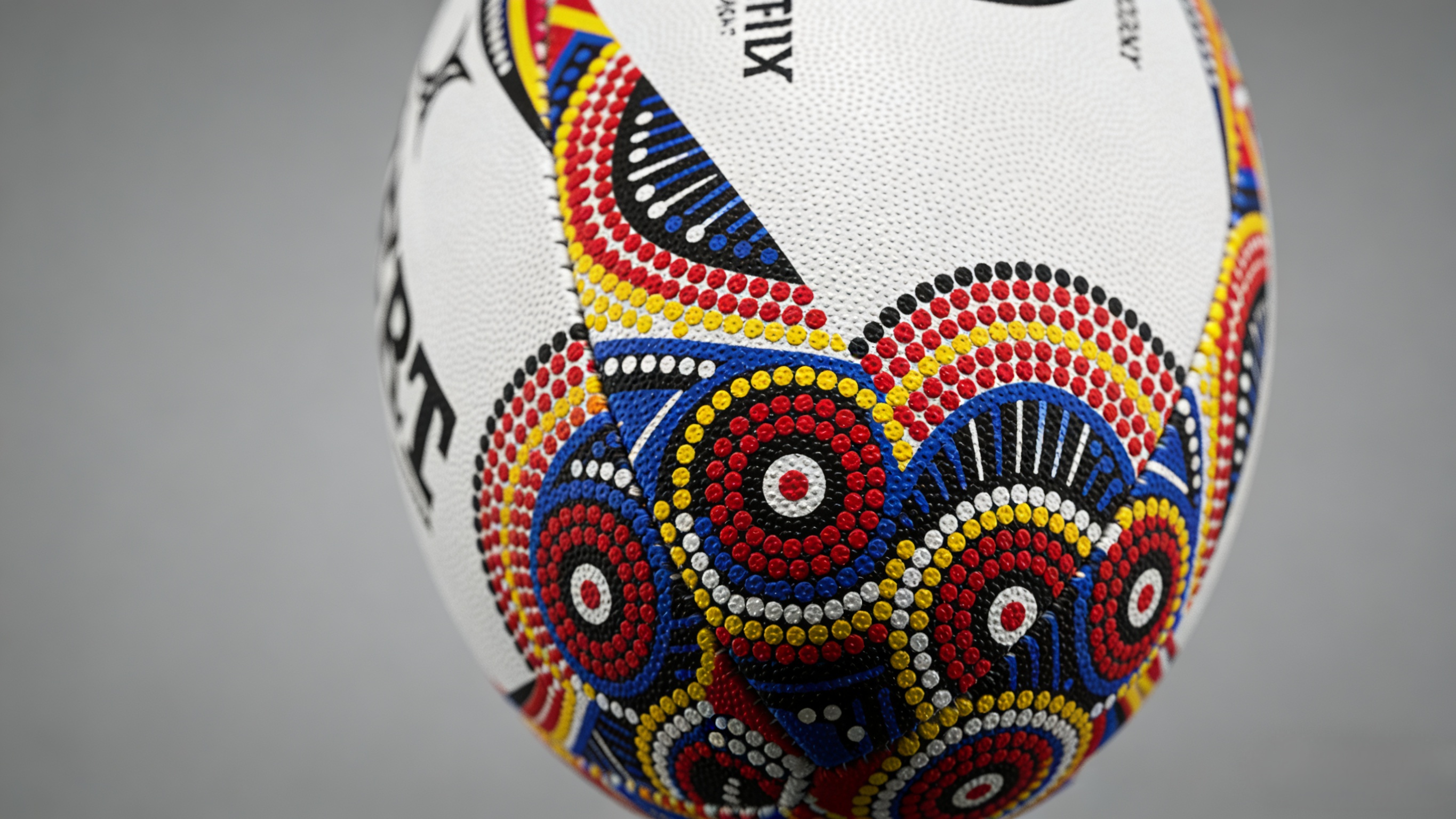 Indigenous Rugby Jersey - Cultural Roots & Designs on the Field 3 Close-up detail of an Indigenous rugby jersey with intricate dot art